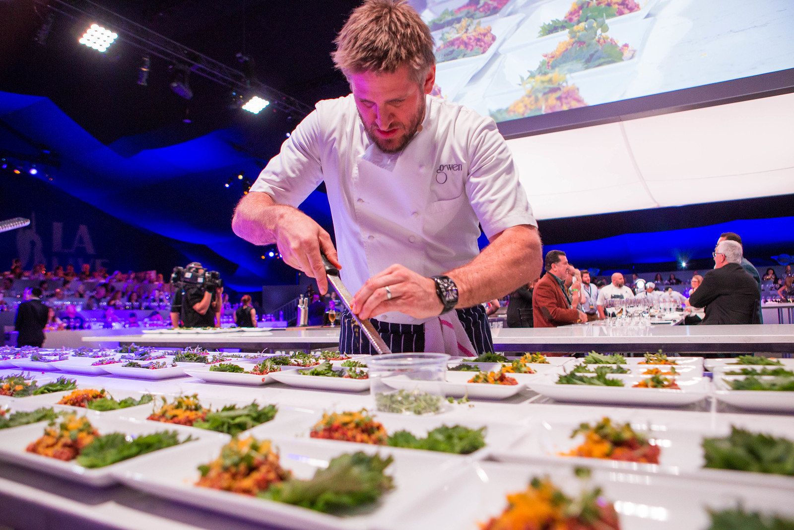 Chef plating food during All Star Chef Classic Event