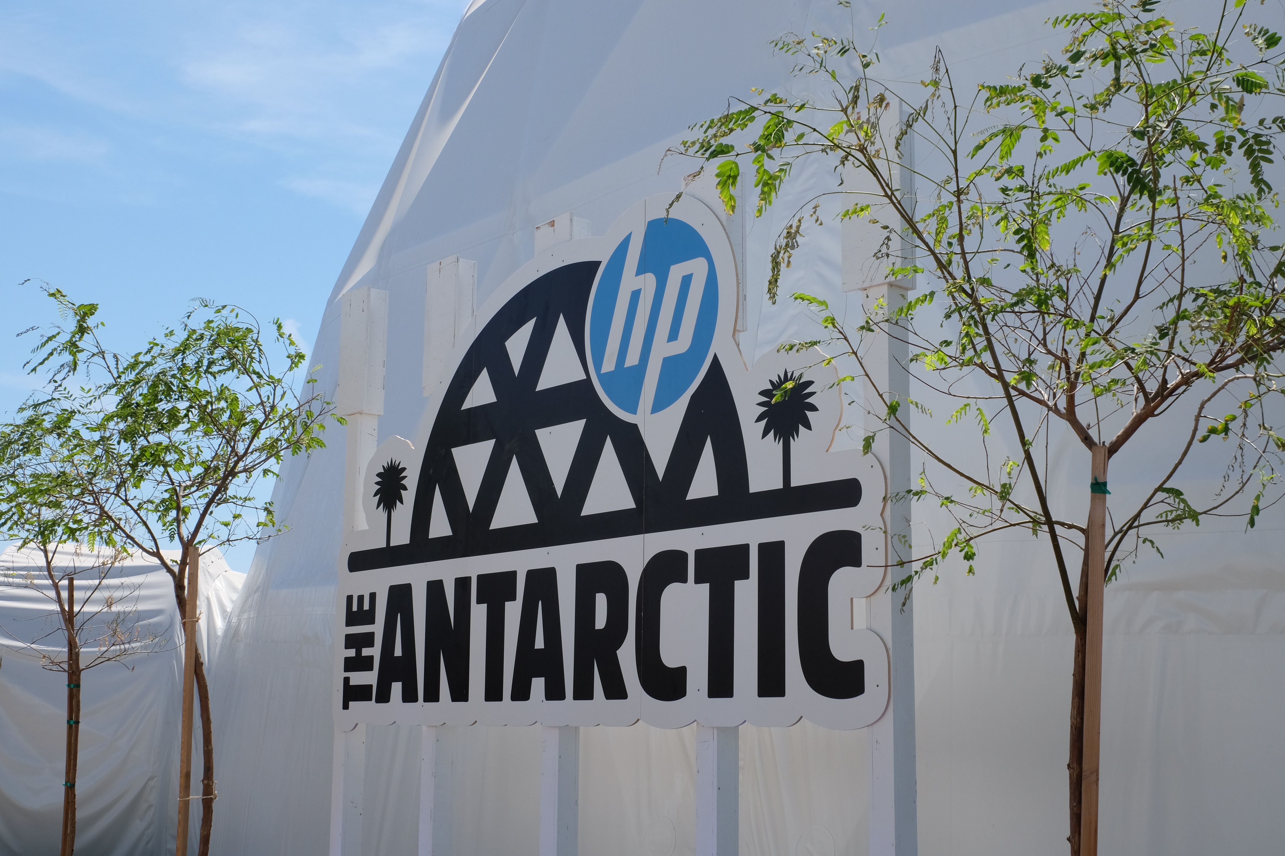 Signage outside a tent that says "The Antarctic" with the HP logo