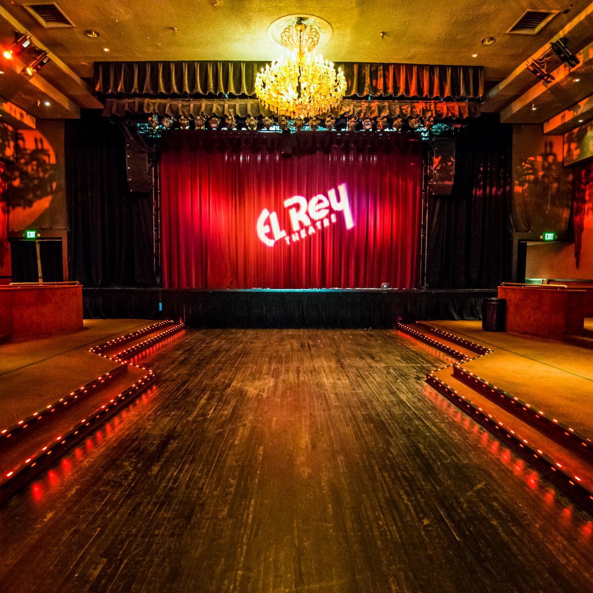 Dimly lit interior shot of El Rey and stage without guests