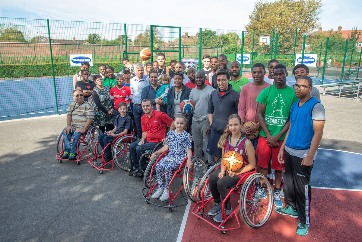 Group of people on basketball court