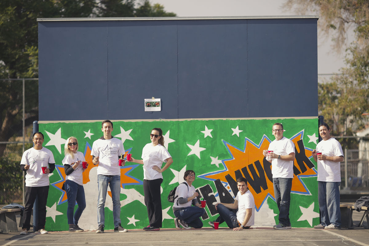 employees painting a mural