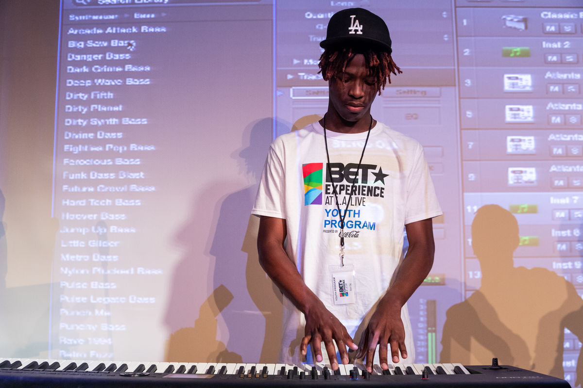 A student in the BET Experience Youth Program participates in a music production class where he learns to layer a beat at the GRAMMY Museum at L.A. LIVE.