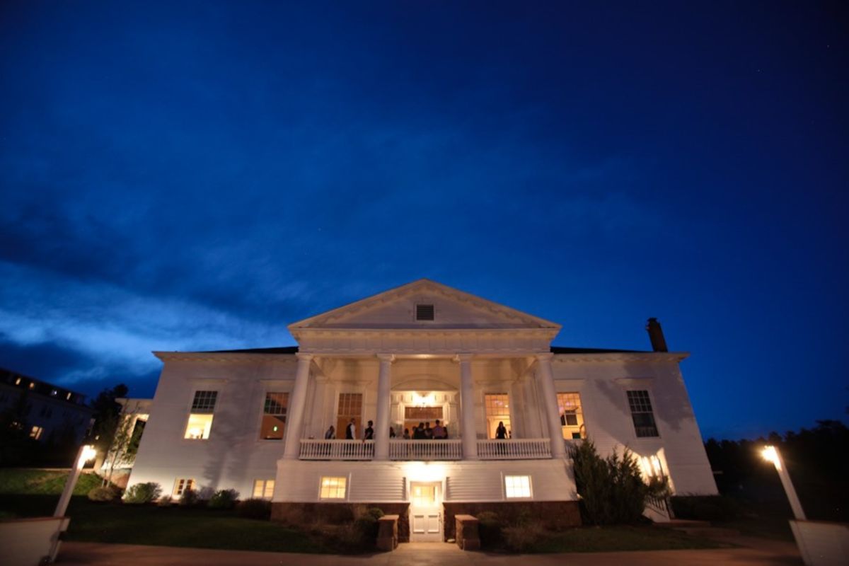 The Stanley Hotel in Estes Park Colorado is illuminated at night. 