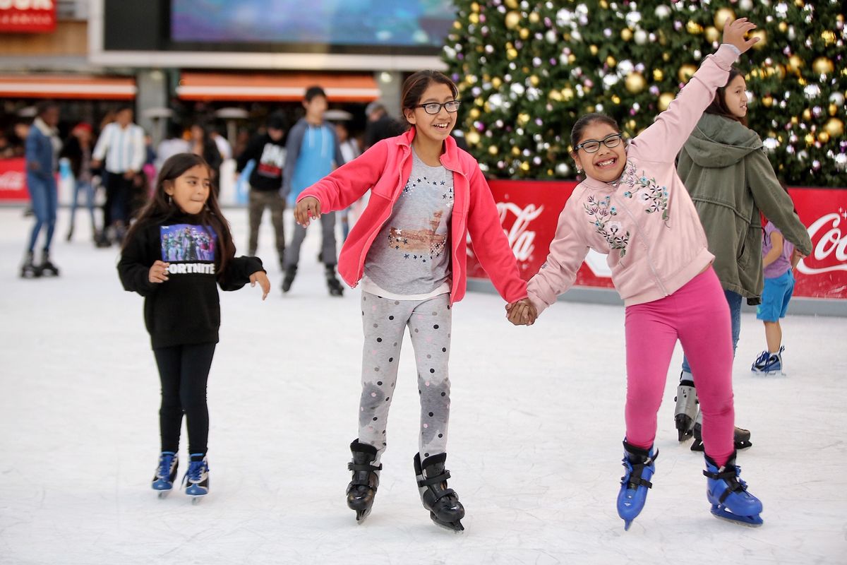 Children ice skate at LA Kings Holiday Ice at L.A. LIVE as part of AEG's annual Community Holiday Party on December 18, 2019.