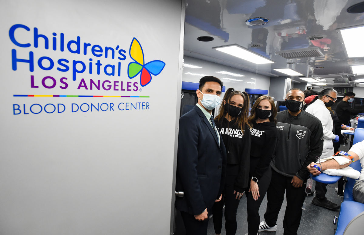 LA Kings fans and staff tour the LA Kings Blood Mobile during a blood drive at Crypto.com Arena. 