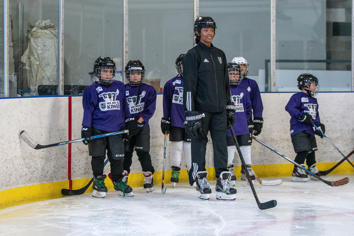 Participants at the LA Kings' We Are All Kings Camp receive instruction from Blake Bolden, AHL Scout and Growth and Inclusion Specialist for the LA Kings.