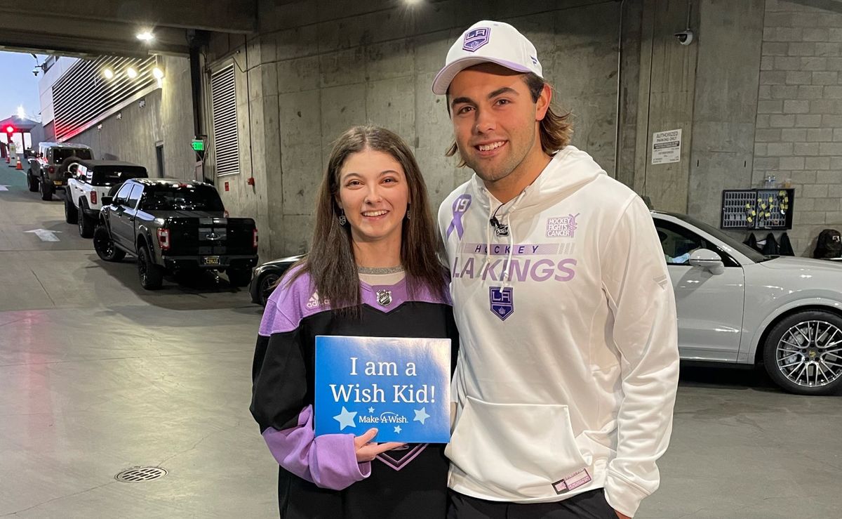 Make-A-Wish recipient Samantha Kayne posing with LA Kings' Alex Iafallo.