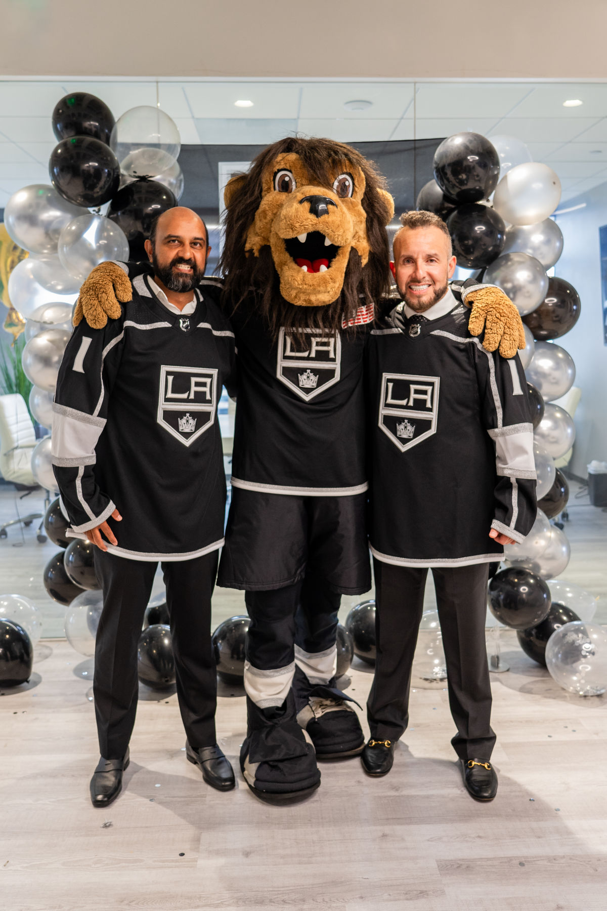 CD LAW partners and co-founders Vineet Dubey and Miguel Custodio are joined by LA Kings mascot Bailey to celebrate CD LAW's new 