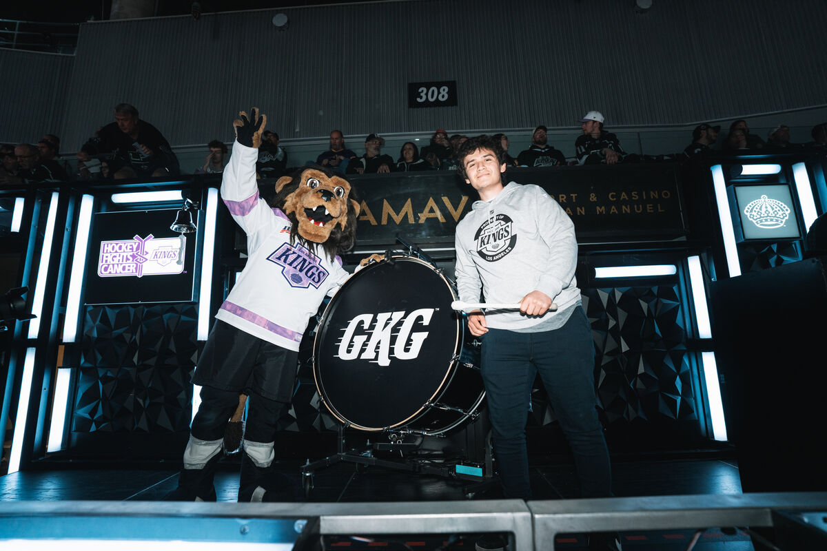 LA Kings mascot, Bailey and special guest lead the ceremonial drum cheer at the recent LA Kings Hockey Fights Cancer Night prese